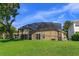 Spacious backyard features a screened in pool and ample room to entertain at 6160 Froggatt St, Orlando, FL 32835