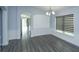 Dining room boasts hardwood floors, decorative trim, and large windows providing natural light at 6160 Froggatt St, Orlando, FL 32835