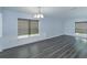 Dining room area featuring hardwood floors, decorative trim, and large windows for natural light at 6160 Froggatt St, Orlando, FL 32835