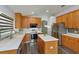 Modern kitchen featuring stainless steel appliances, island, and plenty of cabinet space at 6160 Froggatt St, Orlando, FL 32835