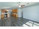 Open concept living room and kitchen combo with hard surface flooring and modern features at 6160 Froggatt St, Orlando, FL 32835