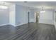 Open-concept living area featuring hardwood floors, archways, and recessed lighting at 6160 Froggatt St, Orlando, FL 32835