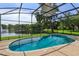 Enjoy the backyard view of the fountain and lake from this screened pool at 6160 Froggatt St, Orlando, FL 32835