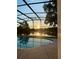 Enjoy stunning sunset views from the backyard screened pool overlooking the tranquil lake at 6160 Froggatt St, Orlando, FL 32835