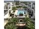 Aerial view of pool, patio, townhomes, and lush landscaping at 630 Vassar St # 2508, Orlando, FL 32804