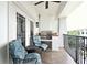 Relaxing outdoor balcony with built-in grill, seating, and wrought iron railings at 630 Vassar St # 2508, Orlando, FL 32804