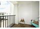 This balcony features a nice sitting area with a metal bucket and chair at 630 Vassar St # 2508, Orlando, FL 32804