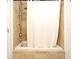 Bathroom shower and tub with tiled walls and shower curtain at 630 Vassar St # 2508, Orlando, FL 32804