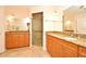 Bathroom featuring double vanities, granite counters, and a walk-in shower at 630 Vassar St # 2508, Orlando, FL 32804