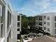 Exterior view between two buildings showing courtyard and water feature at 630 Vassar St # 2508, Orlando, FL 32804