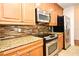 Beautiful kitchen with stainless steel appliances and granite countertops at 630 Vassar St # 2508, Orlando, FL 32804