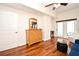 Bright living room featuring wood floors, ceiling fan, and access to balcony at 630 Vassar St # 2508, Orlando, FL 32804