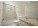 This is a bathroom with a bathtub, toilet, and sink; natural light and a classic design at 6416 Jackwood Ct, Orlando, FL 32818