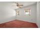 Vacant bedroom with plush carpeting, neutral paint and a ceiling fan at 6416 Jackwood Ct, Orlando, FL 32818