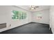 Empty carpeted room with large windows offering bright natural light at 6416 Jackwood Ct, Orlando, FL 32818