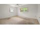 Bright bedroom with natural light from two windows, ready for your personal touch at 6416 Jackwood Ct, Orlando, FL 32818