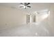 Spacious living room with tile floors and ceiling fans, perfect for entertaining and relaxation at 6416 Jackwood Ct, Orlando, FL 32818