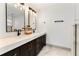 Elegant bathroom featuring a dual sink vanity with quartz countertops, stylish fixtures, and modern lighting at 7440 Houston E Ct, Winter Park, FL 32792