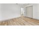 Bright bedroom featuring smooth neutral flooring, closet and doorway at 7440 Houston E Ct, Winter Park, FL 32792