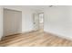 Bright bedroom featuring hardwood floors, neutral walls and a closet with paneled doors at 7440 Houston E Ct, Winter Park, FL 32792