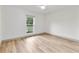 Bedroom featuring a large window for natural light with neutral flooring at 7440 Houston E Ct, Winter Park, FL 32792
