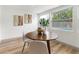 Cozy dining area with a round table, bright natural light, and pool view at 7440 Houston E Ct, Winter Park, FL 32792