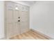 Bright foyer featuring a contemporary double door, light wood flooring, and neutral decor at 7440 Houston E Ct, Winter Park, FL 32792