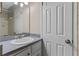 Bathroom features vanity with a white sink and neutral countertop at 7449 Daniel Webster Dr # 3, Winter Park, FL 32792