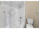Bathroom features white tile bathtub, shower, and toilet at 7449 Daniel Webster Dr # 3, Winter Park, FL 32792