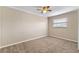 Bedroom with carpeted floor, ceiling fan, and natural light from a window at 7449 Daniel Webster Dr # 3, Winter Park, FL 32792