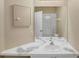 Bathroom featuring double sinks, a vanity mirror, neutral colors, and a shower-tub combo at 8113 Sun Palm Dr, Kissimmee, FL 34747