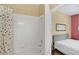 Bathroom featuring a shower with tiled walls and a patterned shower curtain at 8113 Sun Palm Dr, Kissimmee, FL 34747