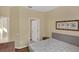 Bedroom with light colored walls with views to the bathroom and hallway at 8113 Sun Palm Dr, Kissimmee, FL 34747