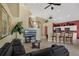 The open-concept design features the living room, kitchen with bar seating, and staircase leading to the second floor at 8113 Sun Palm Dr, Kissimmee, FL 34747