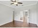 Bedroom featuring hardwood flooring, a ceiling fan and french doors at 8623 Summerville Pl, Orlando, FL 32819