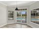 Cozy dining area with bright natural light and views of the pool area at 8623 Summerville Pl, Orlando, FL 32819