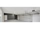 Spacious two car garage with sealed concrete floor, lots of room for storage and work bench at 8623 Summerville Pl, Orlando, FL 32819