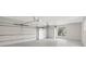 Spacious two car garage featuring white walls, sealed concrete floor and lots of room for storage at 8623 Summerville Pl, Orlando, FL 32819