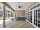 Covered patio area with tile flooring including a built in bar with outdoor sink at 8623 Summerville Pl, Orlando, FL 32819