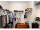 Walk-in closet complete with shelving, racks, hanging storage, and a wooden cedar chest on the floor at 1028 Salamanca Pl, Davenport, FL 33837
