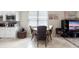 Cozy dining area adjacent to the kitchen features natural light and room to gather at 1028 Salamanca Pl, Davenport, FL 33837