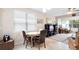 Cozy dining area featuring natural light and view into the living area at 1028 Salamanca Pl, Davenport, FL 33837