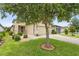 Well-maintained lawn and landscaping surround this home with a brick-paved driveway at 1028 Salamanca Pl, Davenport, FL 33837