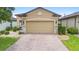 Attractive curb appeal with brick paver driveway and meticulously maintained landscaping at 1028 Salamanca Pl, Davenport, FL 33837
