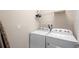 Laundry room featuring a side-by-side washing machine and dryer, plus a wire shelf above at 1028 Salamanca Pl, Davenport, FL 33837