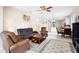 Comfortable living room open to the kitchen featuring tile floors, and cozy seating at 1028 Salamanca Pl, Davenport, FL 33837
