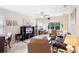 Spacious living room featuring neutral walls, tile floors, with an open design that invites relaxation at 1028 Salamanca Pl, Davenport, FL 33837