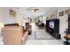 Inviting living room open to kitchen, featuring tile floors, and cozy seating at 1028 Salamanca Pl, Davenport, FL 33837