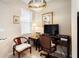 Bright home office space with natural light, featuring a desk and comfortable seating at 1028 Salamanca Pl, Davenport, FL 33837