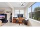 Bright office with natural light, wooden desk, and comfortable chair, ideal for working at home at 1028 Salamanca Pl, Davenport, FL 33837